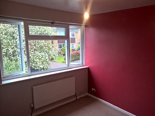 full bedroom re-decoration including paper hanging to one feature wall before