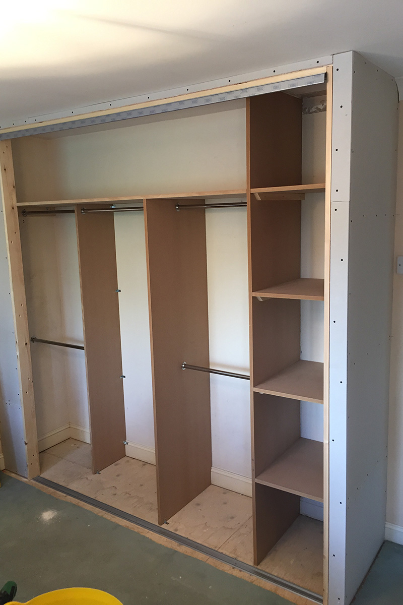 Main-bedroom-built-in-wardrobe-in-progress-shelves-800x1200